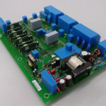 A completely masked circuit board using masking boots ready for conformal coating application